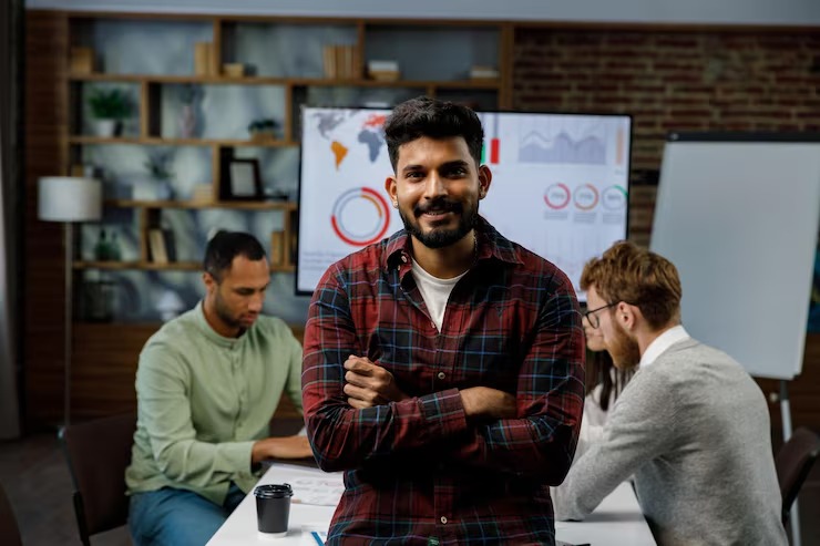 imgi_14_confident-smiling-indian-guy-startup-team-leader-standing-front-mixed-race-office-workers-b_141858-1665